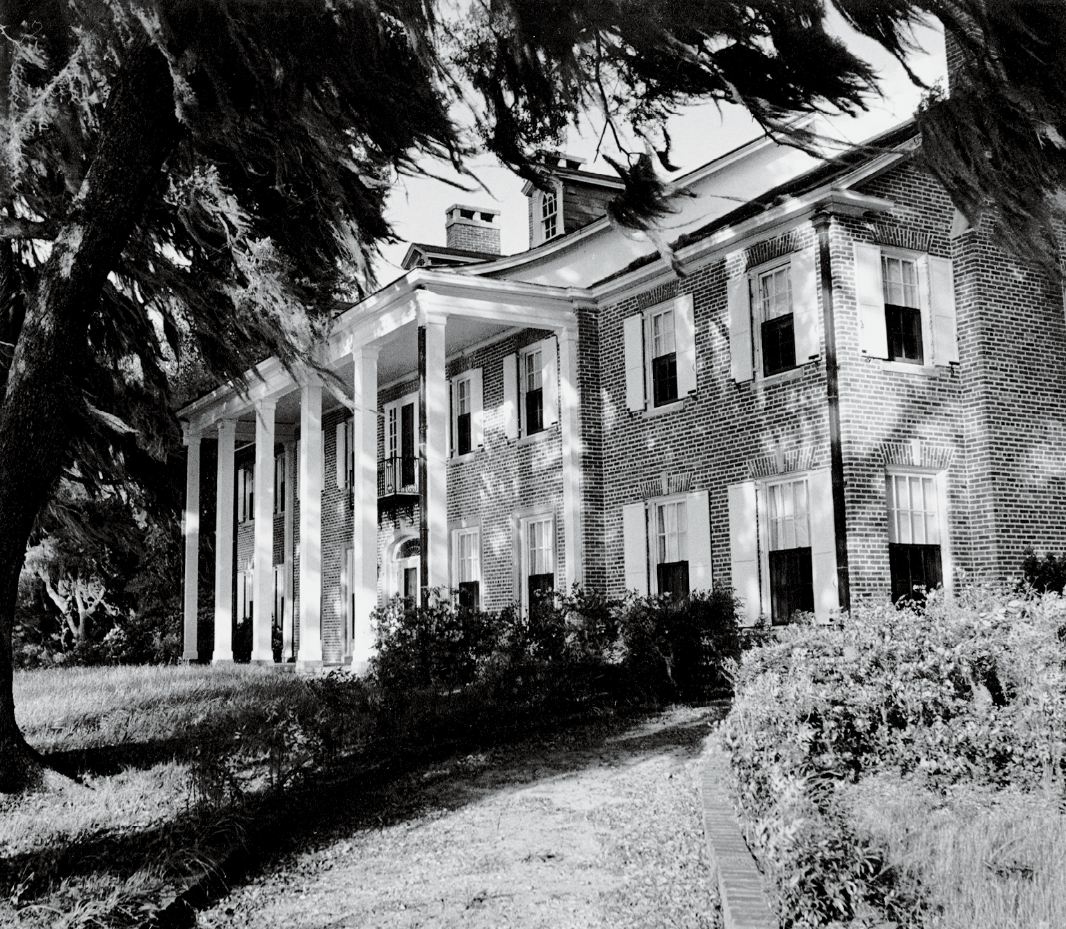 The family’s stately brick Hobcaw House—which Bernard had rebuilt in 1929 after a fire destroyed the original wood home—on a bluff overlooking Winyah Bay