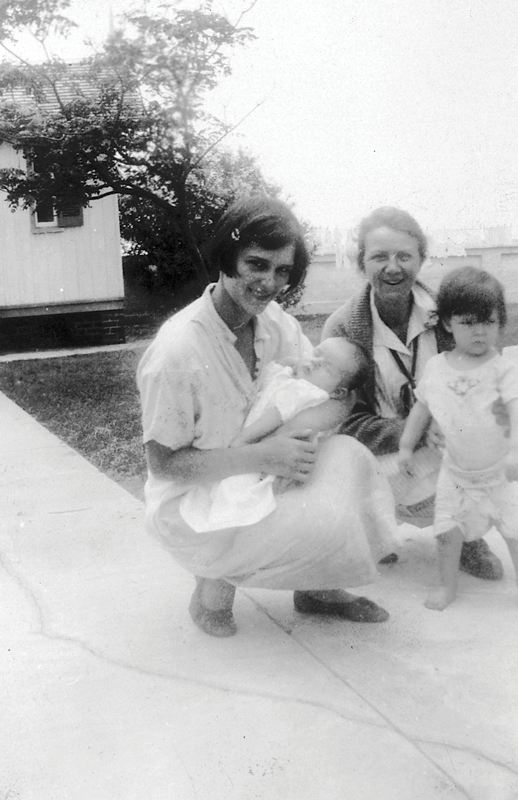 Ester Hecker, wife of keeper William Hecker, holds her daughter, born on the island in October 1929 during a fierce storm.