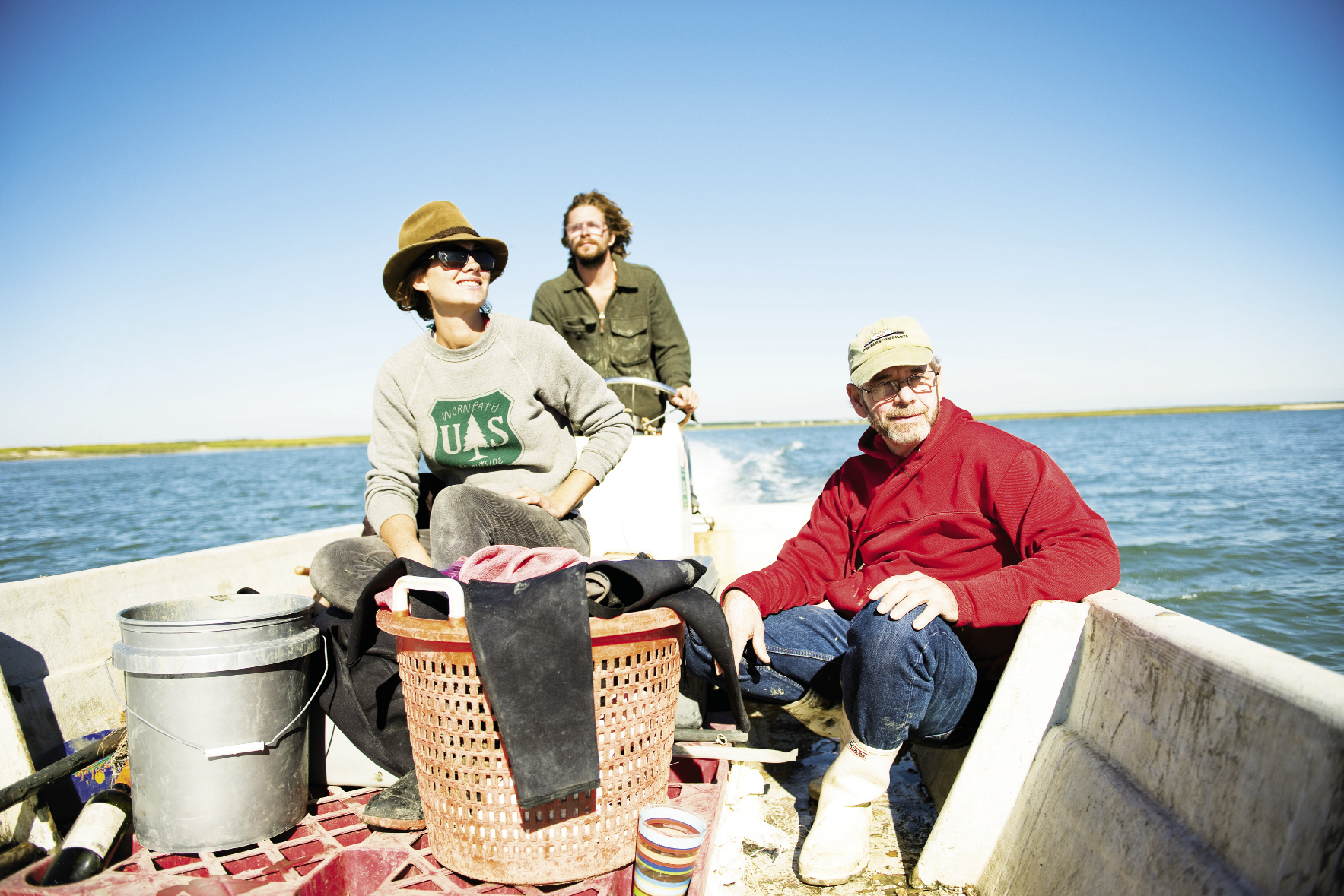 Dave Belanger with employees Catherine Moye and Caleb Bourg, en route to his 25-acre lease behind Dewees