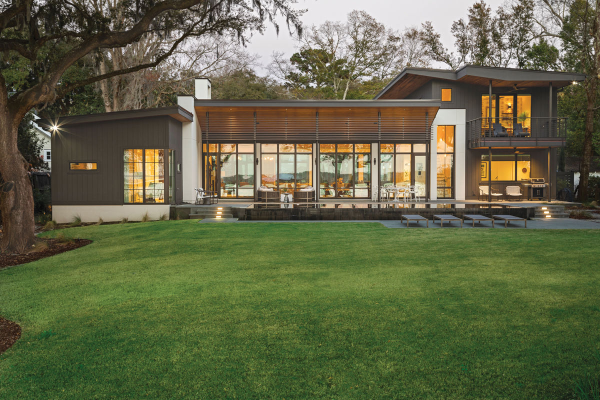 Wide Open: The inspiration for this James Island home was the homeowners’ traditional colonial-style house in West Ashley, with a modern steel-and-glass addition designed by famous architects Clark + Menefee. “That was our favorite part of the house,” says the homeowner, who hired architects Rush and Judy Dixon, disciples of the now-defunct firm, for their new project. Signature features are its mono-slope roof and steel doors and windows that welcome in views of the Stono River.