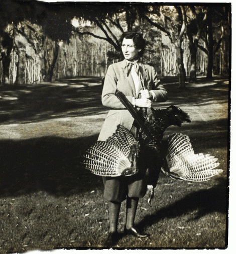 Belle Baruch during a 1936 turkey hunt at her family’s 17,500-acre winter retreat, Hobcaw Barony, near Georgetown, South Carolina; (opposite) the Baruchs, circa 1905, with staff and guests on the porch of “Old Relick,” the original main home on the property