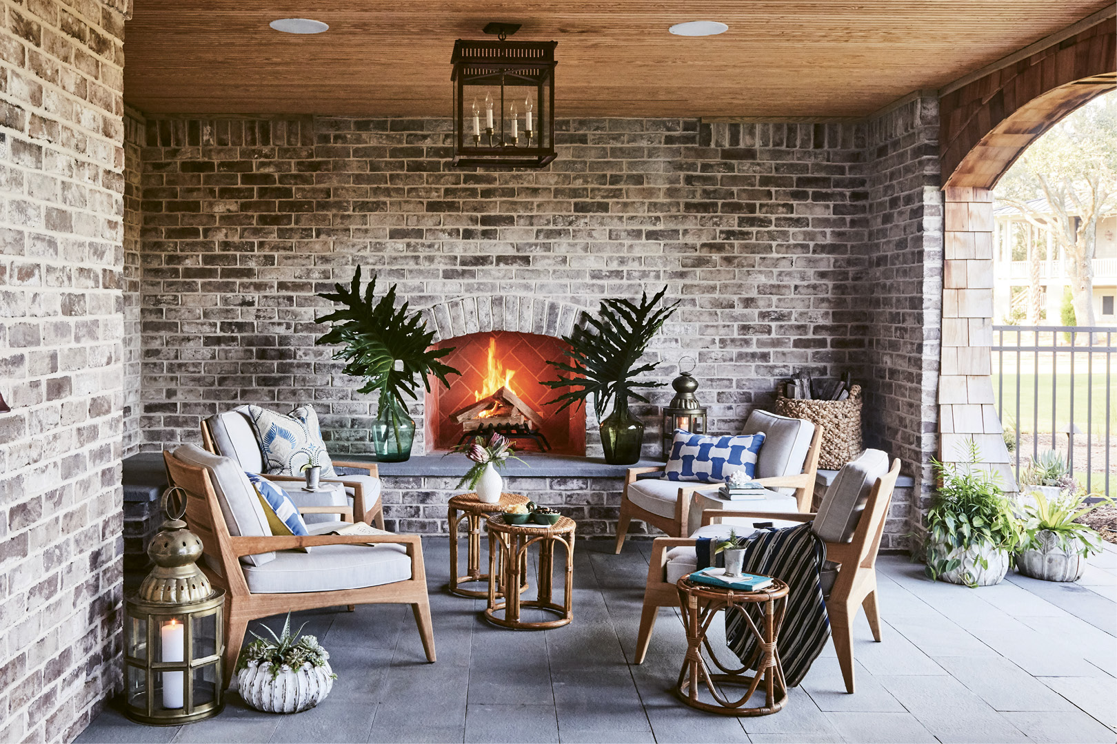 An outdoor living room, complete with fireplace (left), is a cozy entertaining spot, especially on cool winter nights.