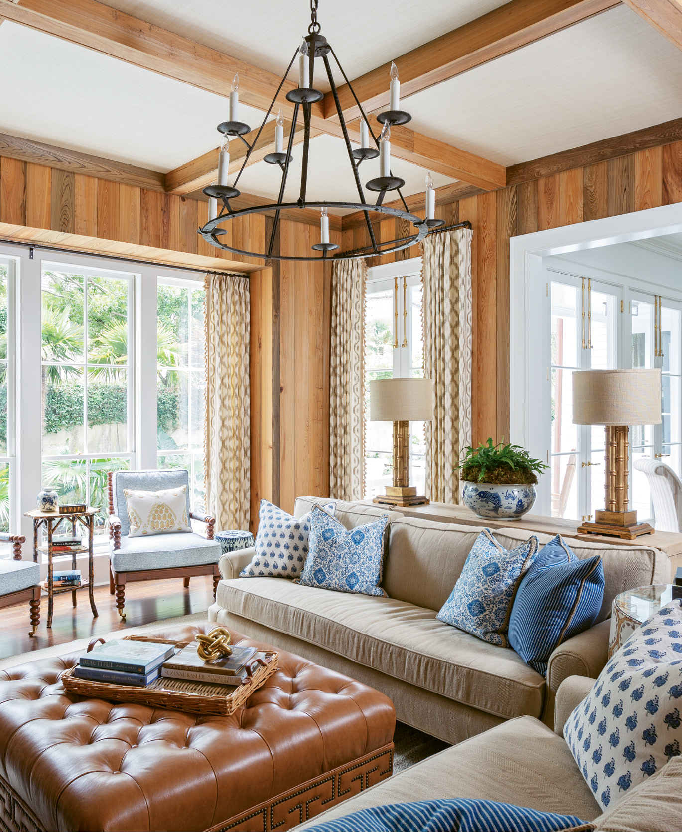 While updating a century-old residence South of Broad, architect Beau Clowney sought to reinstate some of the home’s likely architectural past, such as the cypress paneling in this handsome den.