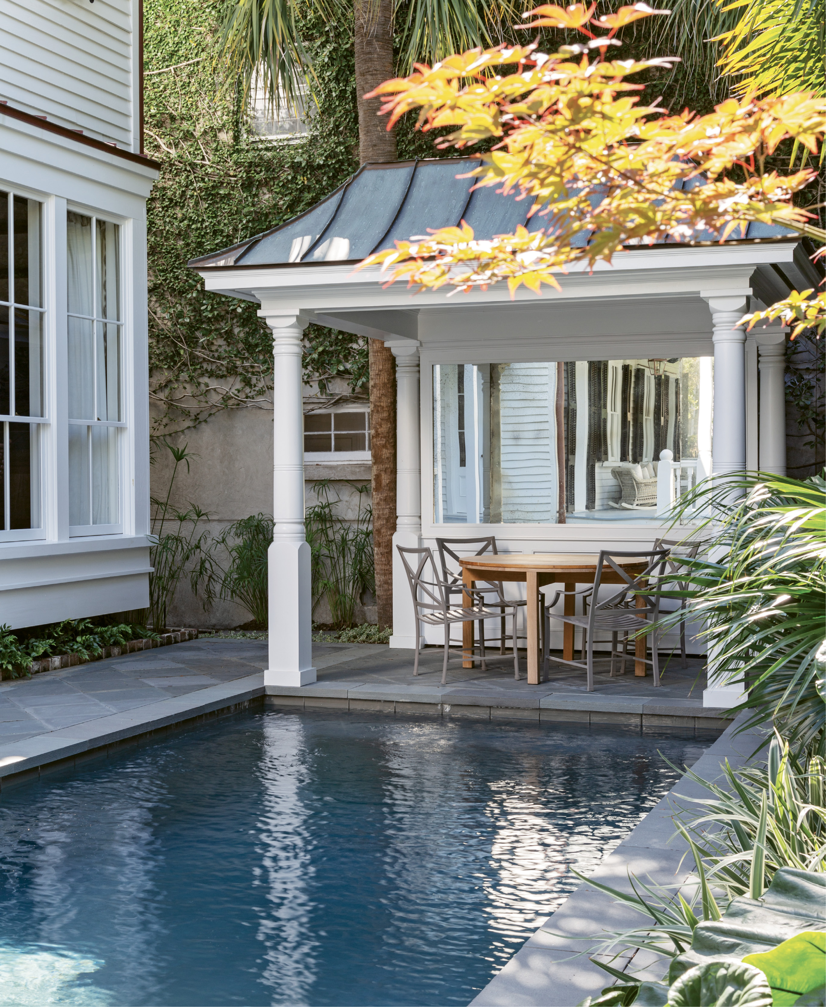 IN THE SWIM: A pool was on the must-have list for the couple, who wanted a spot their children and grandchildren would flock to. The sun-dappled patio provides the perfect perch for relaxing and watching them play.