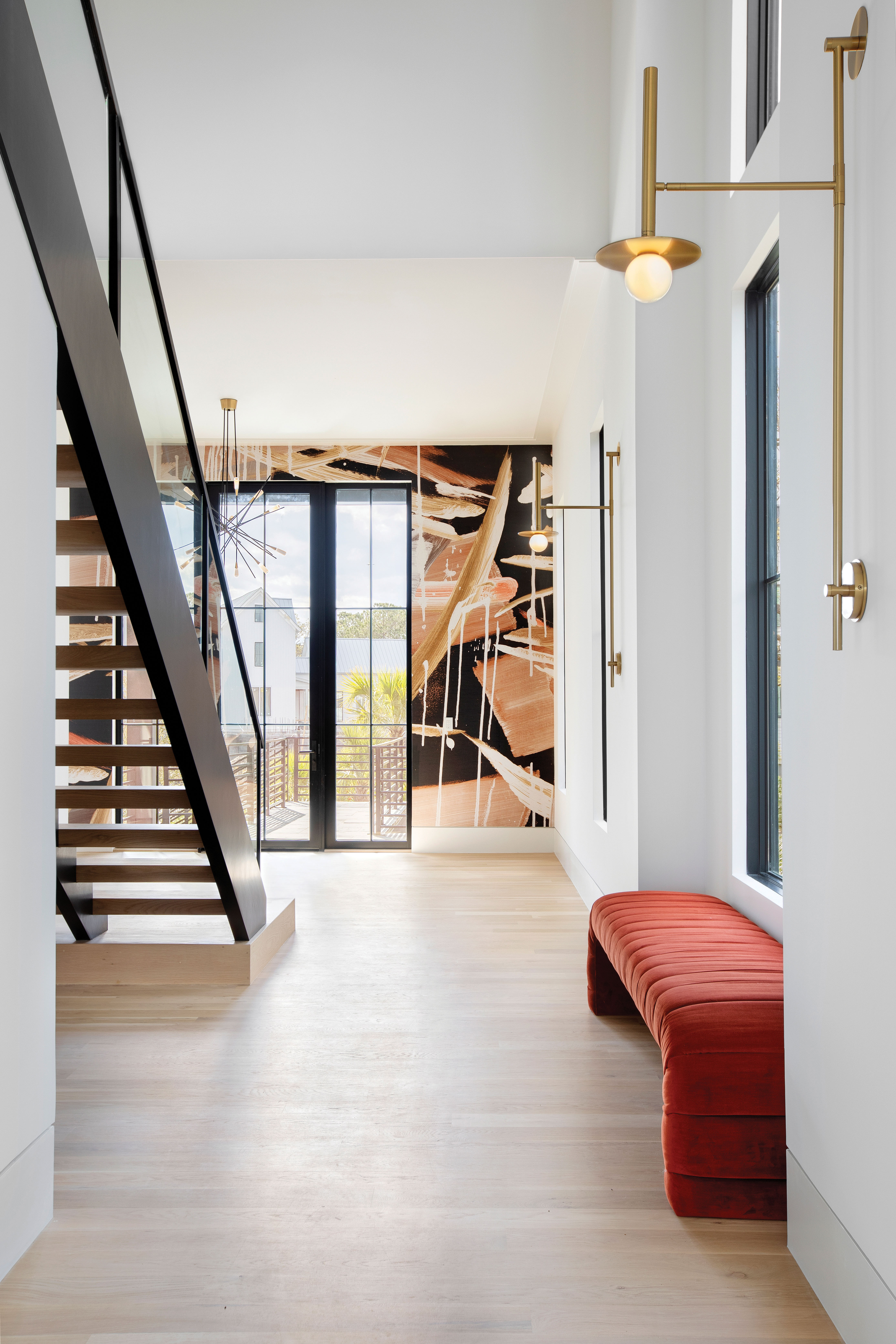 This Daniel Island Park home turns the neighborhood’s aesthetic on its head with a black exterior and sleek, colorful interior highlighted by textured wallpapers, surprising fabrics, and lots of glass.