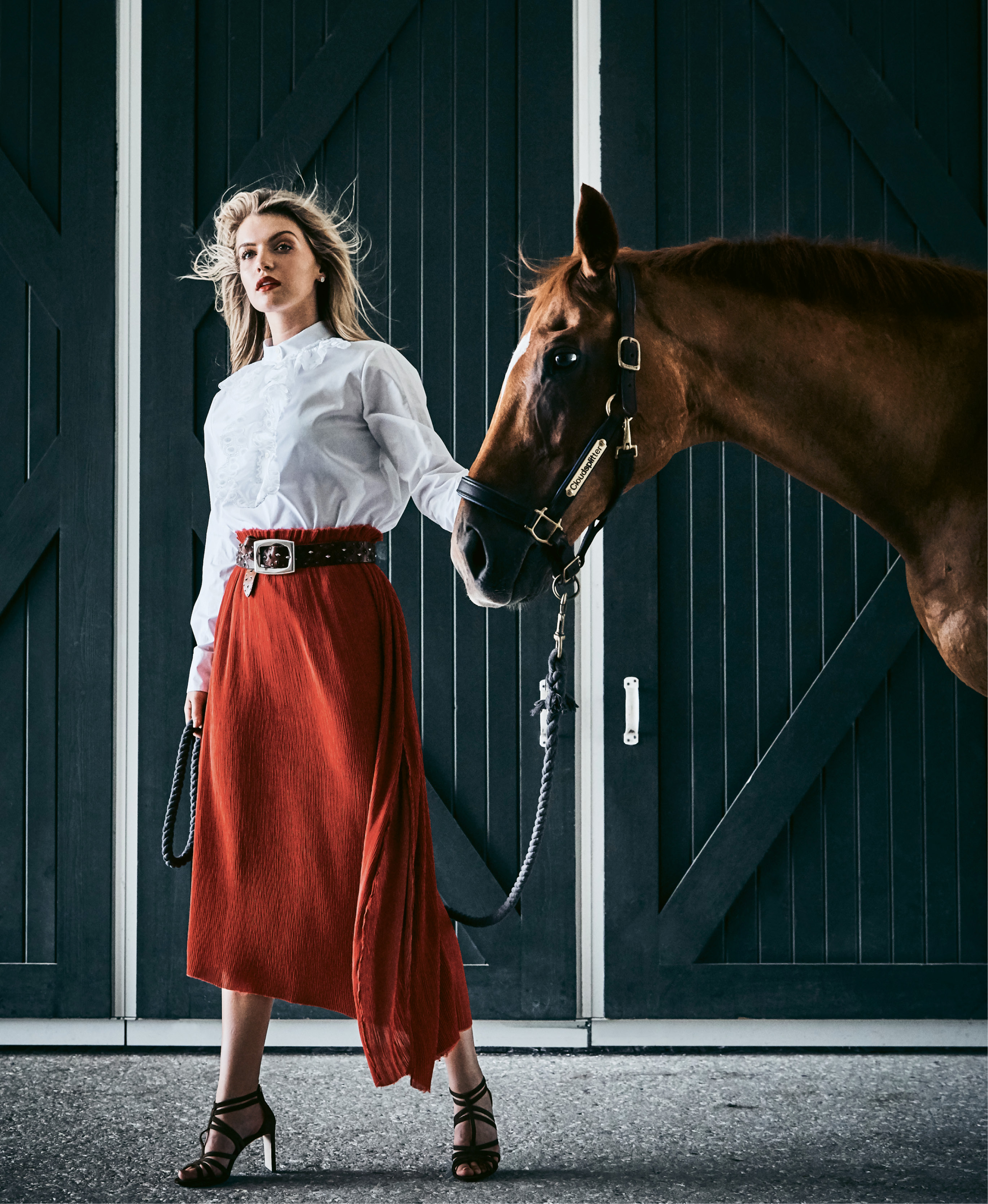 Taking the Lead - Chloé embroidered poplin blouse, price upon request at RTW; Verandah silk-blend midi skirt, $228 at Maris DeHart; Suzi Roher leather belt, $462, and Jimmy Choo “Selina” suede sandal, $850, both at Gwynn’s of Mount Pleasant; Spartina 449 “Night &amp; Day” crystal earrings, $24 at Woodhouse Day Spa.  Pictured with Cloudsplitter (owned by Shelby de Freitas)