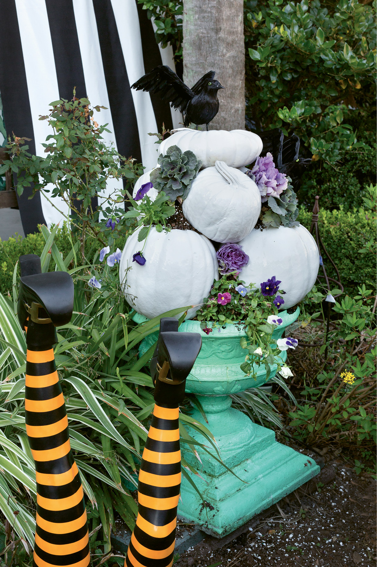 For whimsical garden decorations, fill an urn with potting soil, then balance pumpkins and gourds atop one another, filling the spaces between with more earth.
