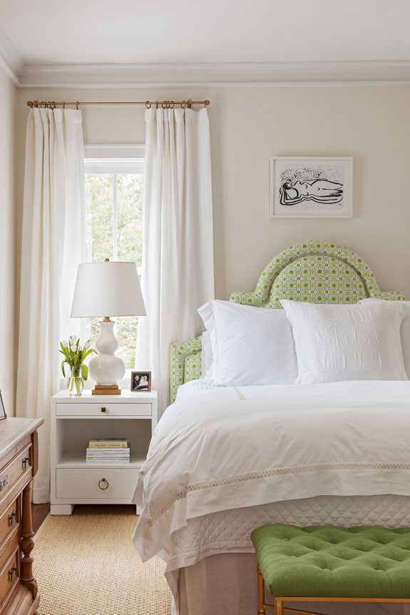 Inspired by views of the adjacent nature preserve, Allison used vibrant green fabrics to upholster a headboard and bench for the master bedroom.
