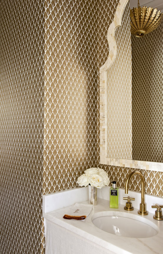 In this petite powder room, Schumacher wallpaper makes a bold statement without overwhelming the eye.