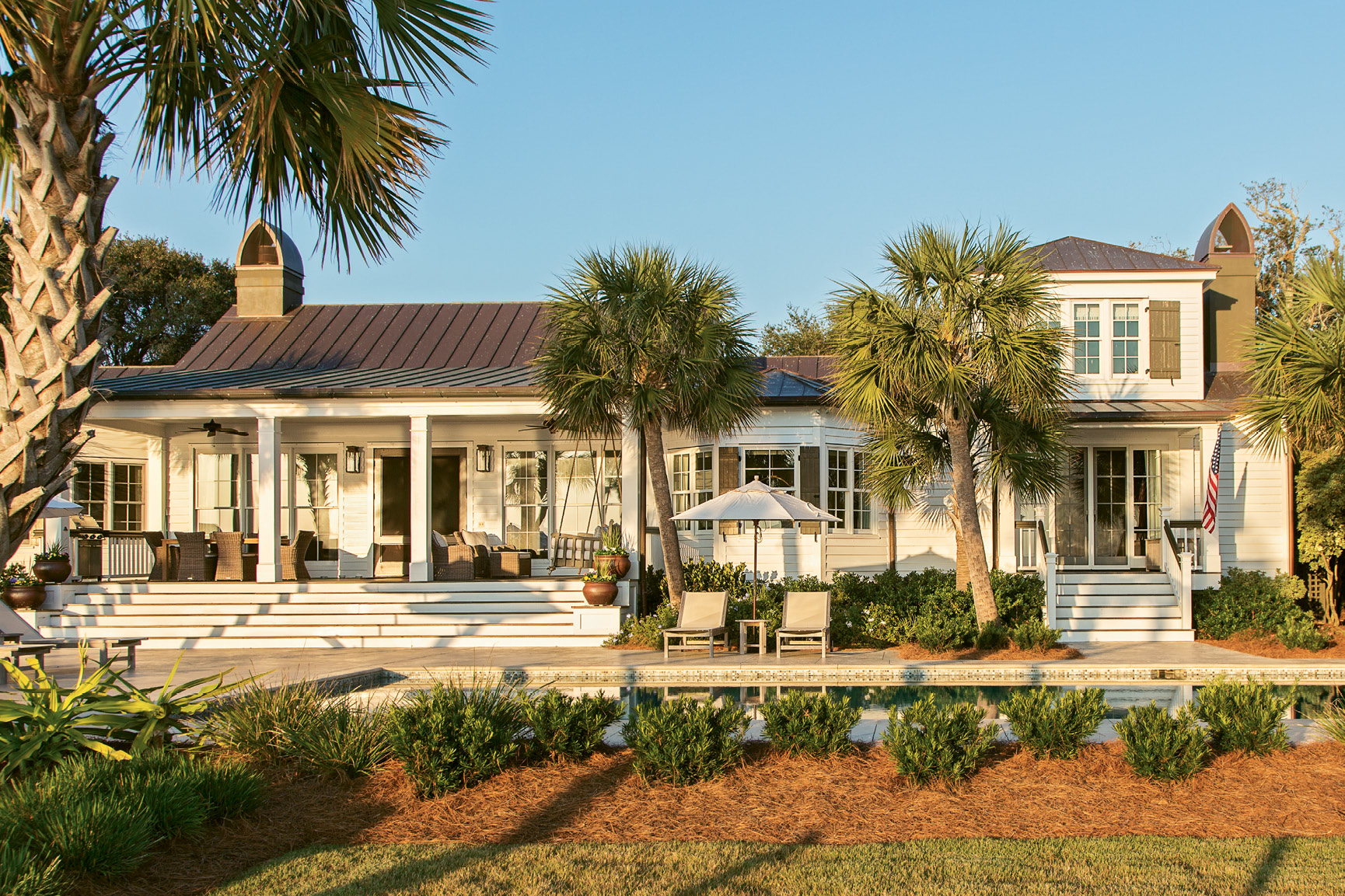 LOVE AT FIRST SIGHT: Charleston native Tara King first fell for this Sullivan’s Island house in her teens. After admiring it from afar for some 25 years, she and her husband, Kirk, purchased the more-than-a-century-old home in 2011. In the process of making it their own, they added a new back porch with French doors to maximize oceanfront views.