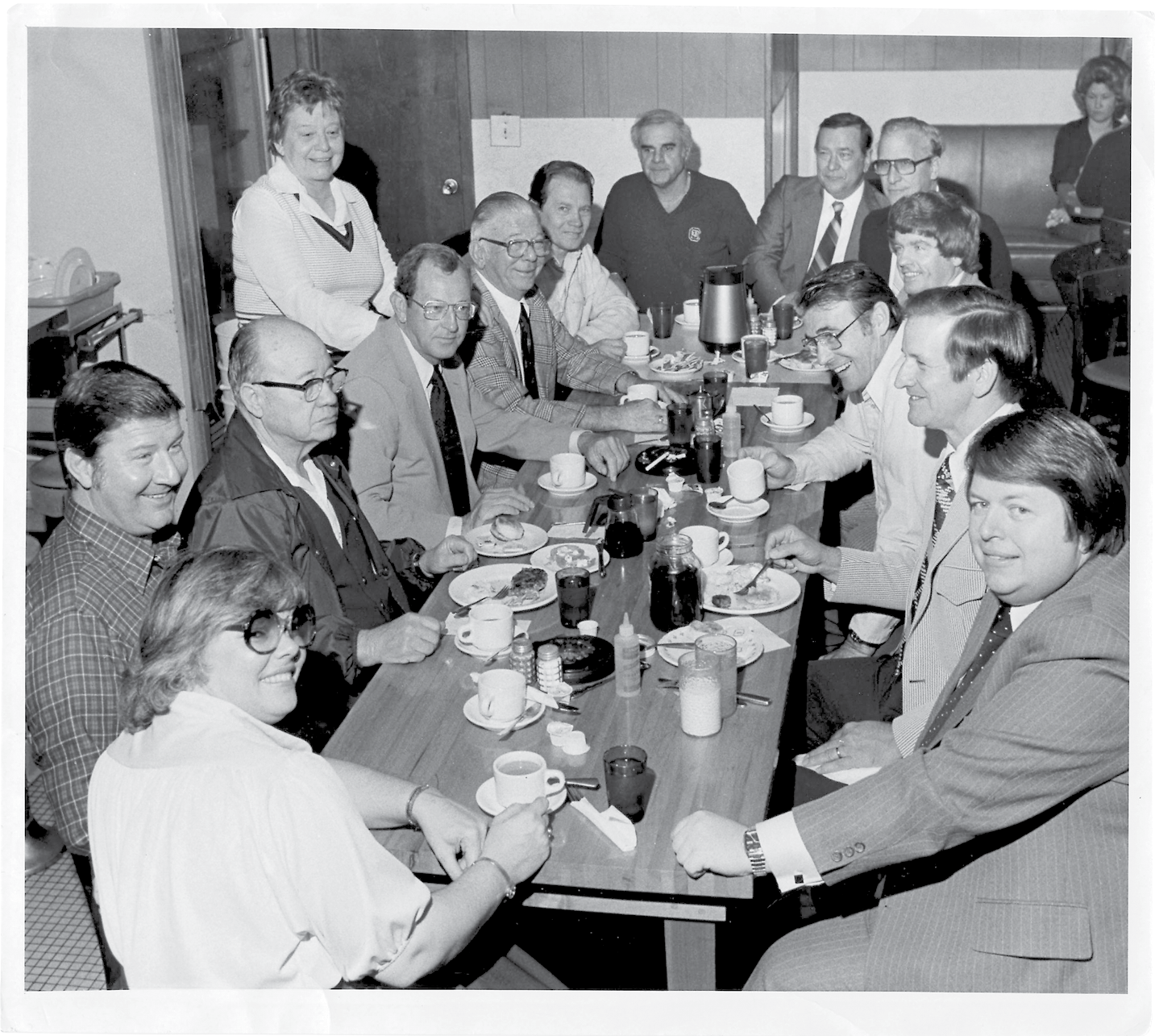 Kitty’s “Coffee Club” circa 1980, its members gathered every morning at 9:15, Miss Kitty is standing on the left.
