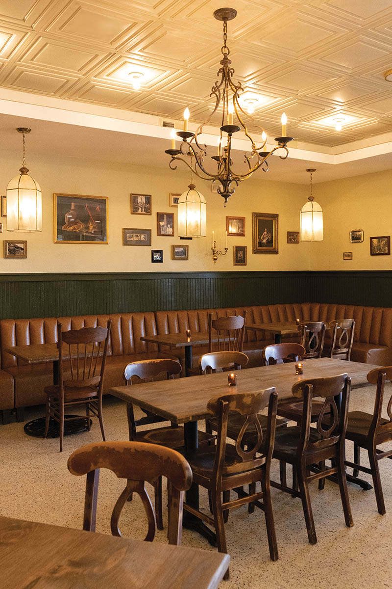 Welcoming banquettes surrounded by framed family photos