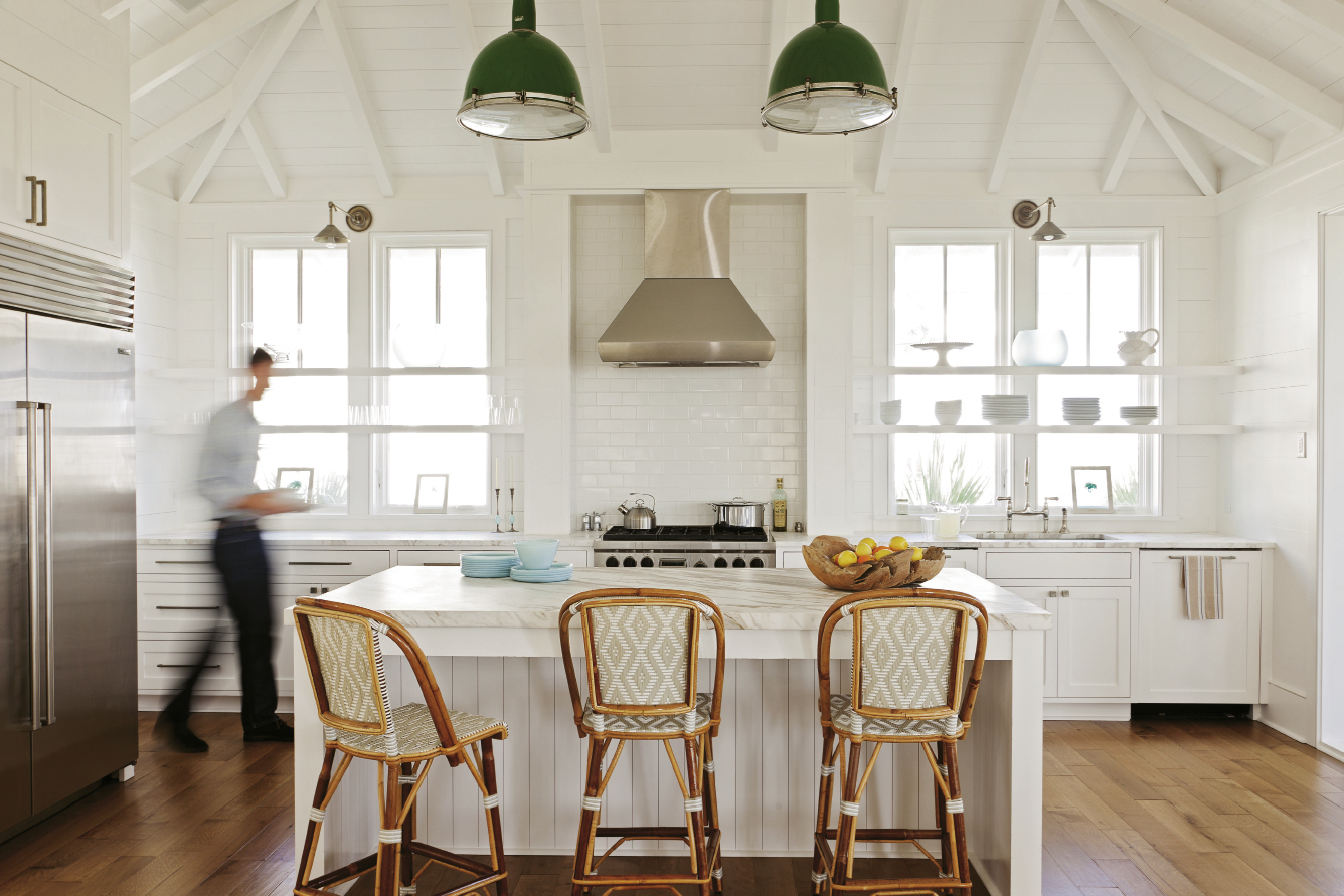 Lights Up: Interior designer Jenny Keenan refashioned two old gymnasium lights, hung by a whipped rope cord, as kitchen pendants.