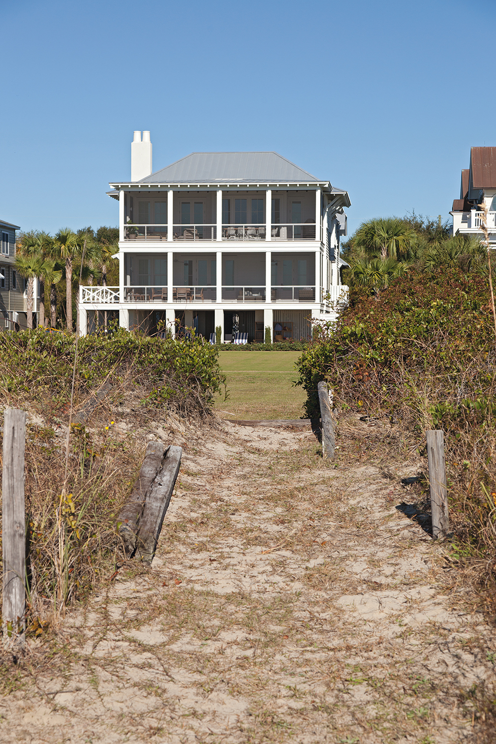 ...while the beachfront façade is a classic, porch-perfect beach house.