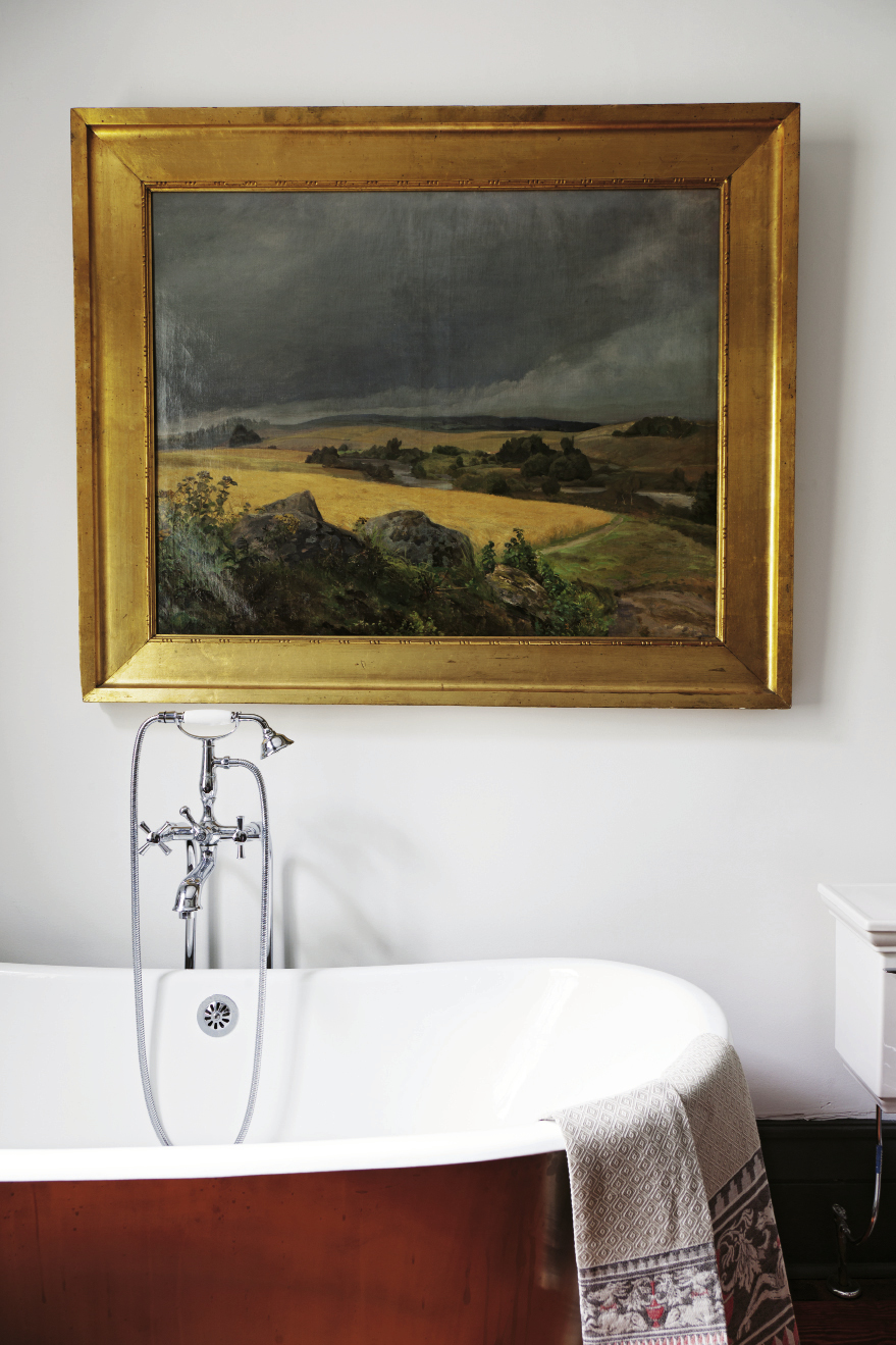 In the master bath, the painting is an antique and depicts the Tuscan countryside.