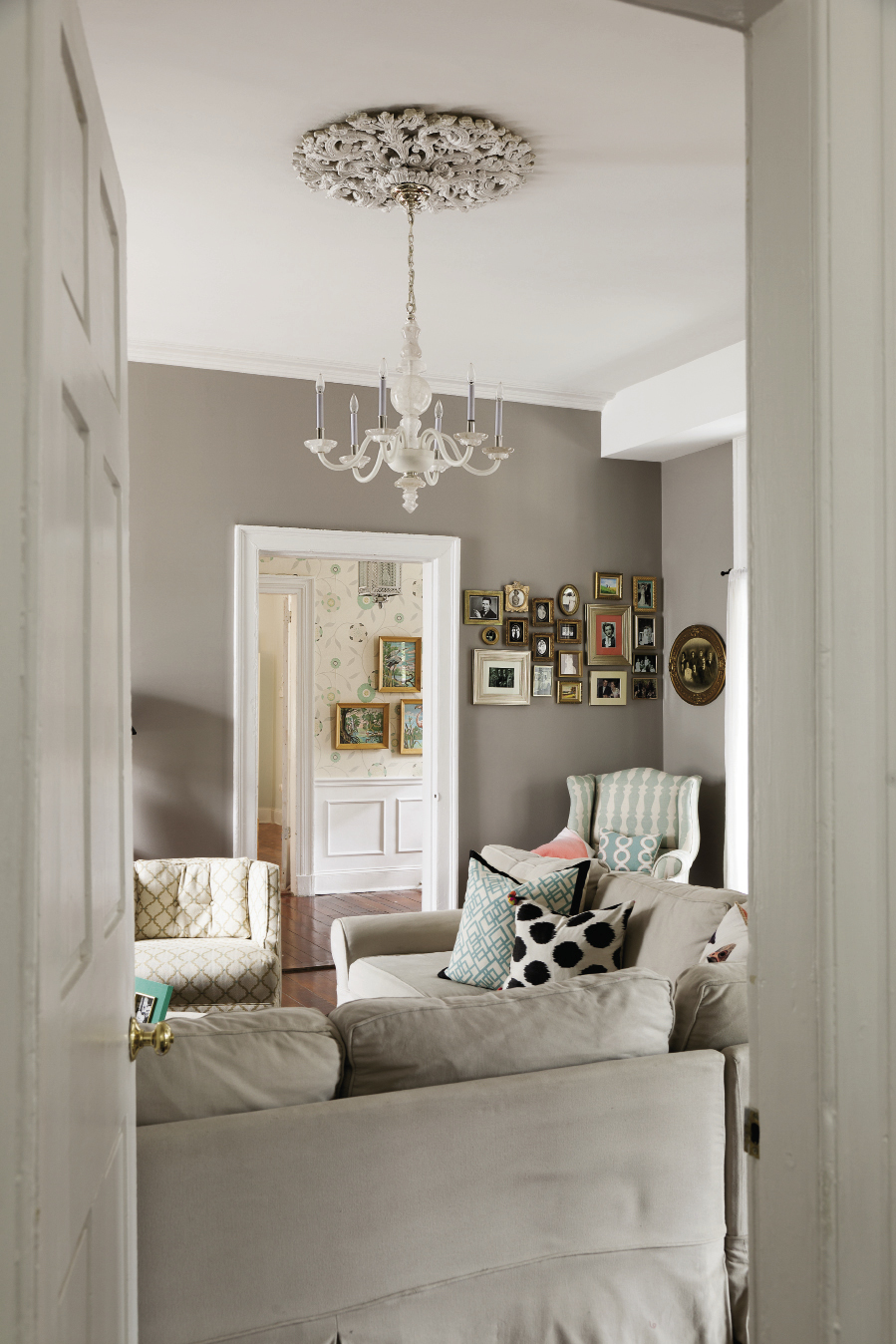 Mixed Mod A cozy mix of a neutral palette, playful patterns, and family-friendly furniture, the Lails’ living room is ideal for all generations, including the ancestors featured in the artful framed collage.