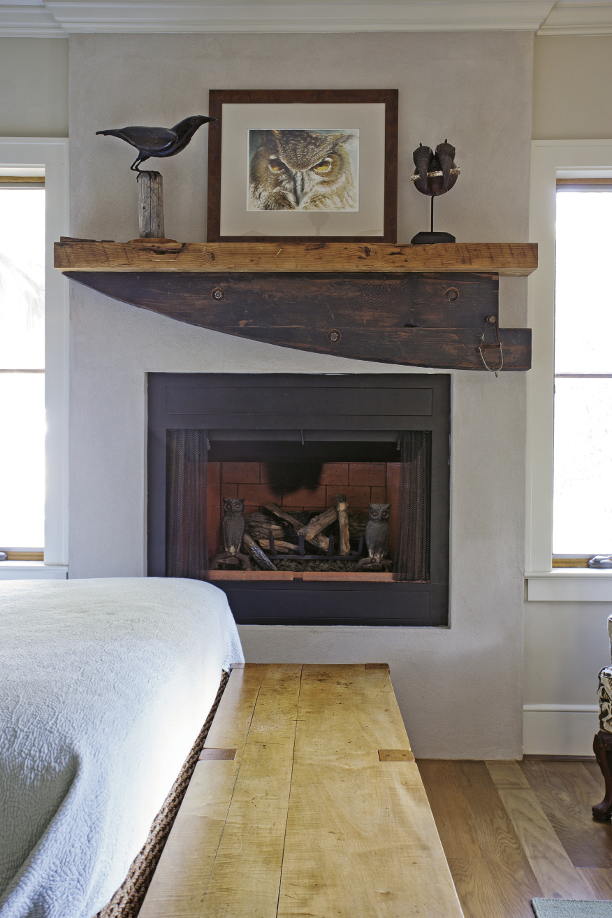 A hunk of wood found roadside on the Charleston Neck was revamped into a fireplace mantel in the first-floor bedroom.