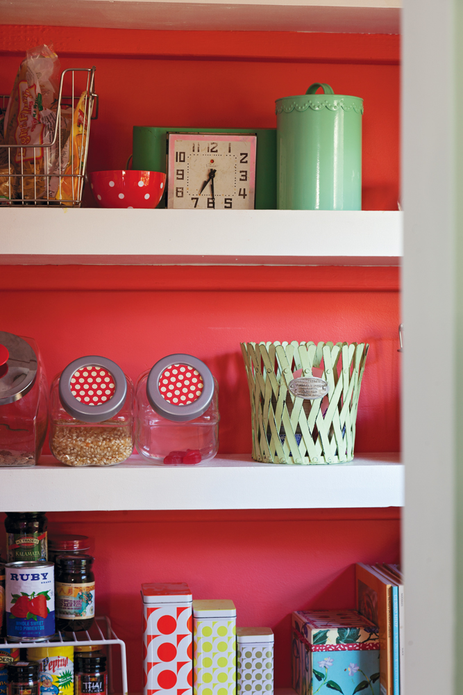 Color Play - A small pantry off the kitchen adds a pop of color.
