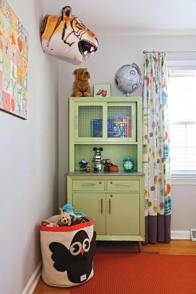 Child’s Play - Playful accents in baby Harry’s room include a painting by Mom and a beloved blow-up tiger head.