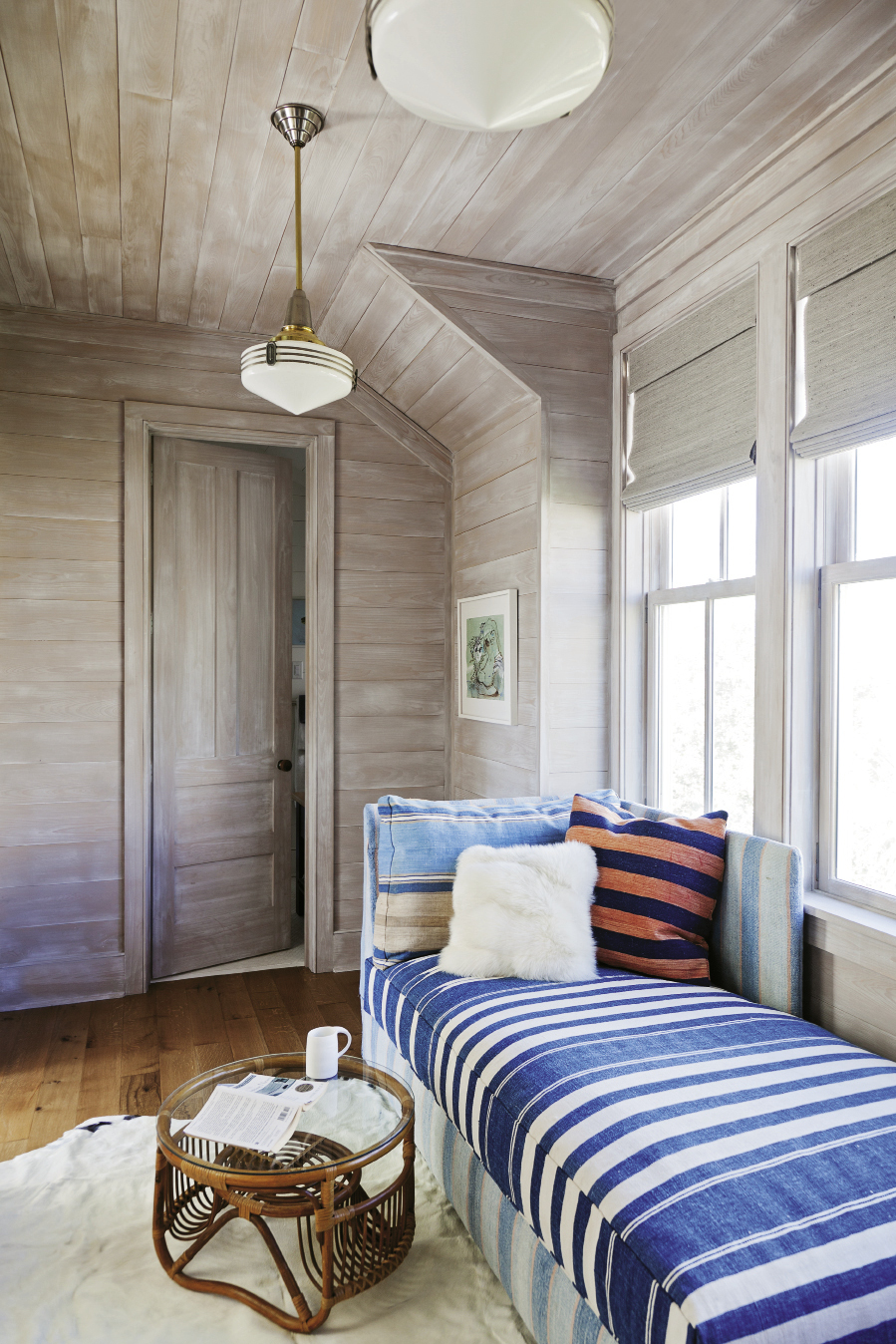 Cozy bedrooms and bunks abound to fit in plenty of visitors, including a double-duty sleeper bench upholstered in a vintage dhurrie in the cedar-lined “office”