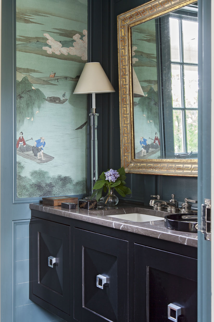 reinvented: Hand-painted panels that Sarah-Hamlin’s grandmother had commissioned during a trip to China find a new home in the first-floor powder room, where they look fresh against walls painted “Amazon Green” by Benjamin Moore.