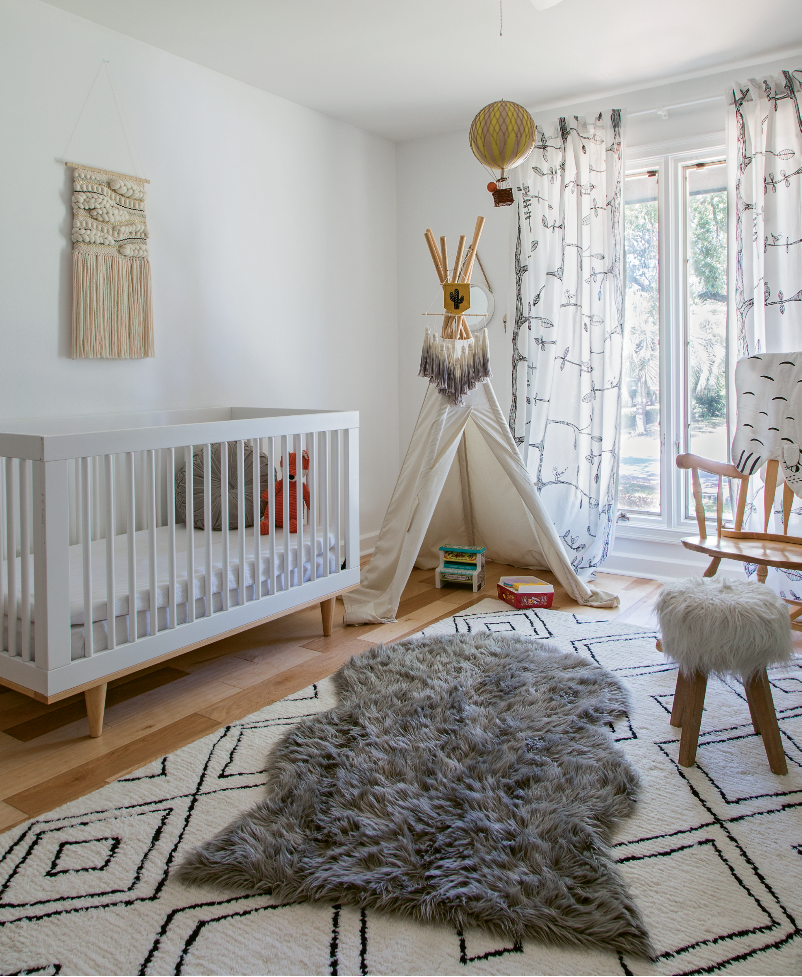 COOL KIDS: The nursery is playful and fun, but still feels sophisticated thanks to a black-and-white palette.