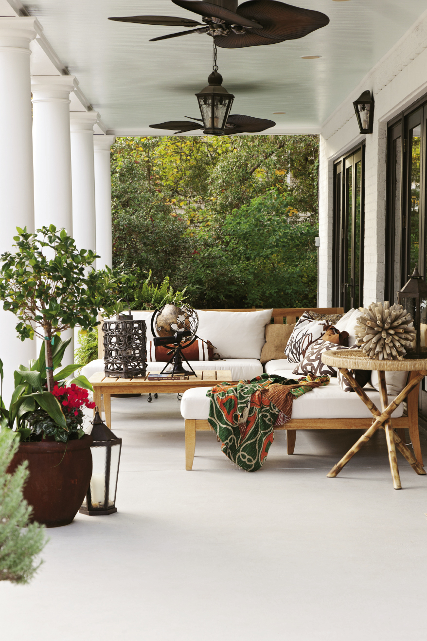 Chill Out: Homeowner Jennifer Moriarty fashioned this creekside veranda for year-round lounging white white canvas.