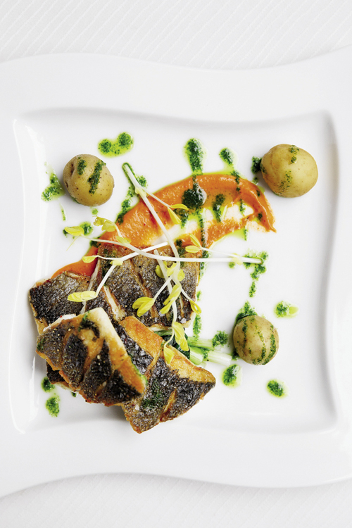 The “pure” section of the menu offers lighter fare, like this branzino with romesco and parsley-garlic puree.