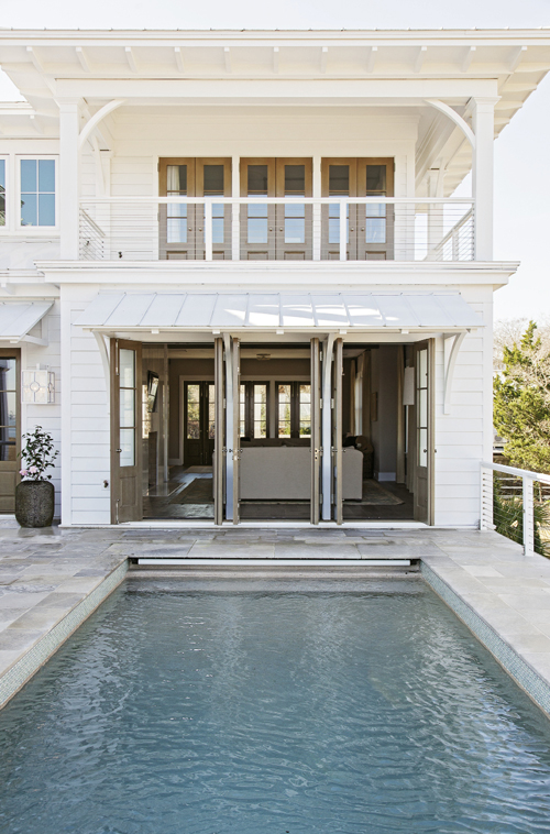 In the Swim: A wading pool graces one of four front porches; in the rear.