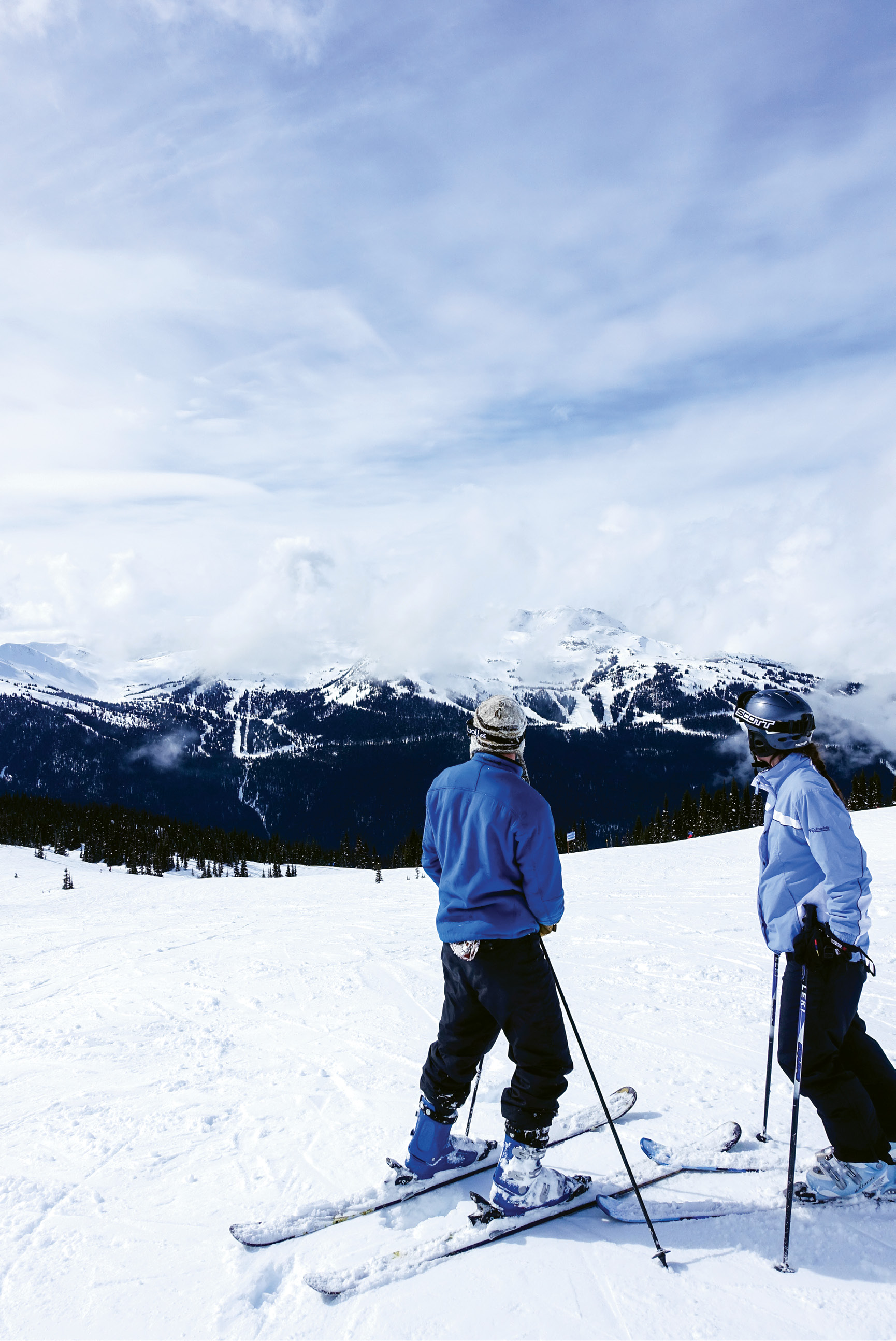 Two Mountains, One Resort: Charleston-born Hank Rudolph V and a friend stand atop a run on Blackcomb Peak and take in the view of Whistler Mountain across the valley, accessible by an awe-inspiring gondola ride.