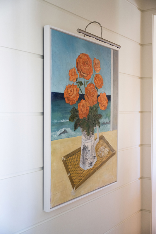 Her Saltwater Roses adds color and personality to the entryway.