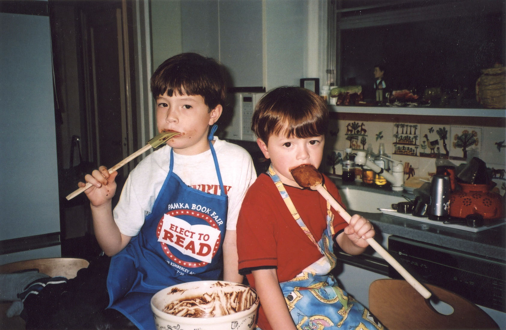 Their sons, Peter and John, helping to make brownies years ago.