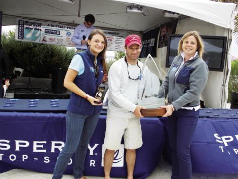 Good Sports: CORA commodore Mike Palazzo accepts the inaugural Jubilee Perpetual Sportsmanship Trophy during Race Week 2013. The award was bestowed on him and his crew for rescuing a man overboard from another boat in foul weather during the race.