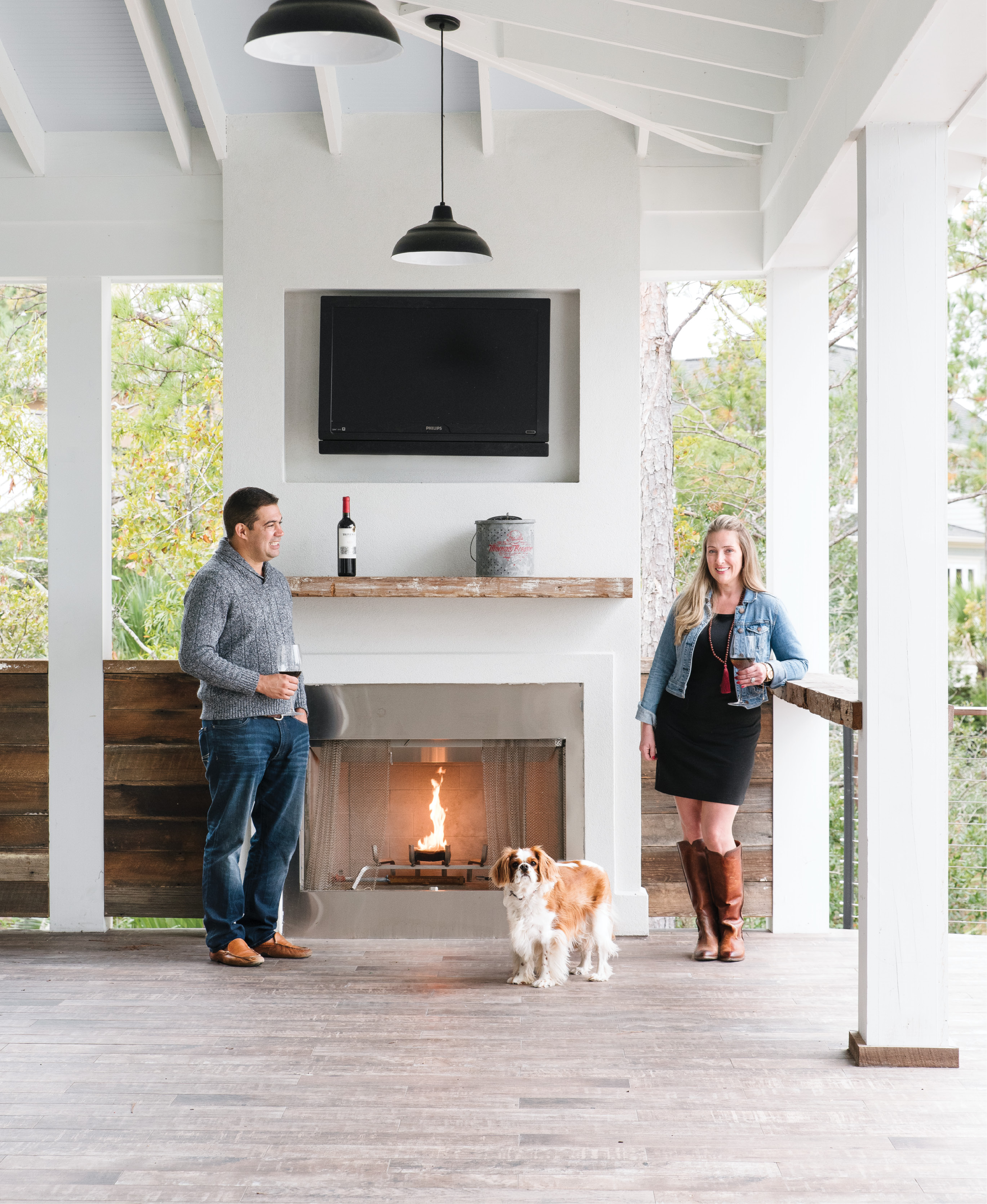 Cooler temps don’t keep Melissa and Valmar Nunes and their adorable pup, Mason, cooped up indoors. The couple designed their RiverTowne abode—complete with a marsh-front pool, open-air kitchen, and this alfresco fireplace—for outdoor entertaining year-round.