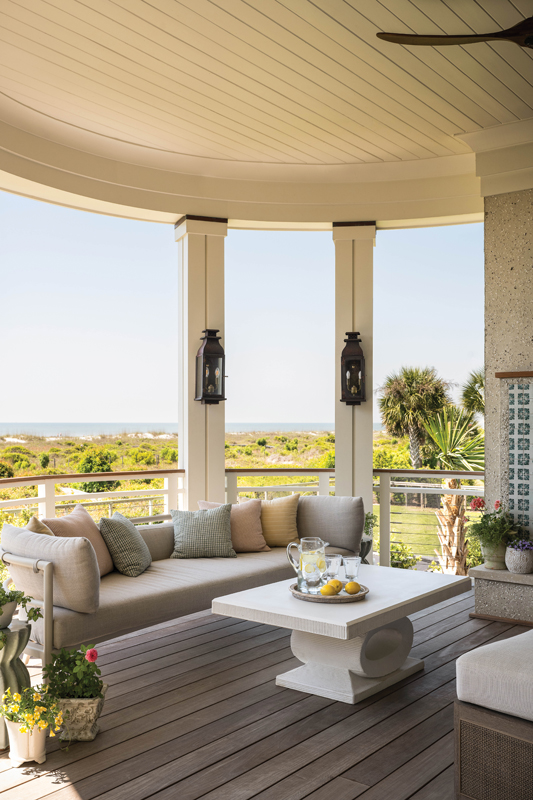 A cozy sitting area surrounds a fireplace decorated with Moroccan tile.