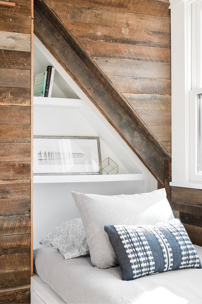 Clever Quarters: Reclaimed wood paneling and geometric built-ins strike the right balance between warm and modern in the guest space.