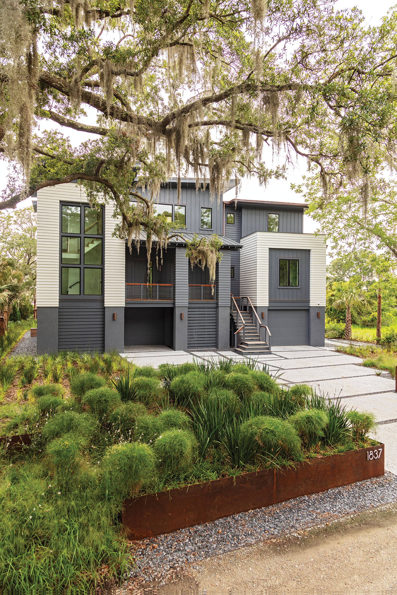Landscape architects Remark helped blend the home into its natural surroundings with a selection of native plants.
