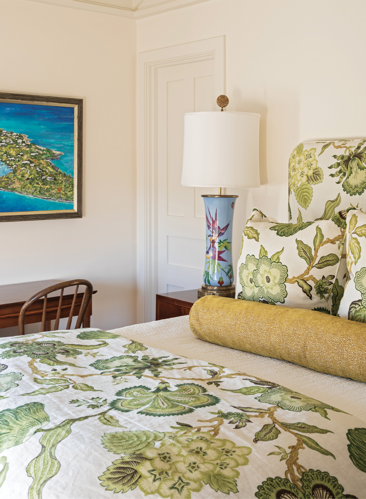 Color them Happy: In contrast to the more subdued palette of the main floor, the upstairs guest bedrooms are vibrant with color. From verdant green reflected in the headboard and coverlet and pillows in Schumacher’s “Hothouse Flowers.”