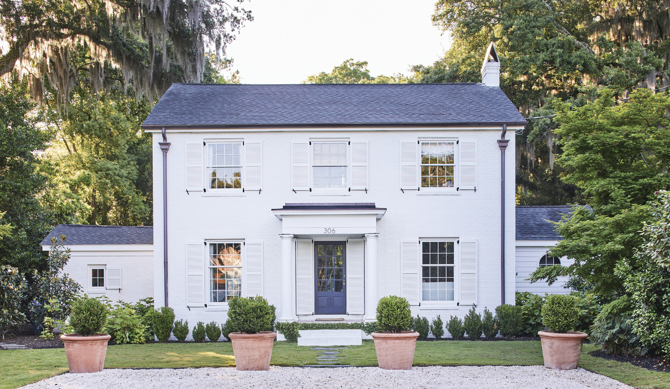WARM WELCOME: Working with Birmingham-based architect Jimmy Laughlin,  James Hewlette and Jordan Kruse upped the Georgian charm of their circa-1950 Riverland Terrace home. “Scaling the windows a little larger made a huge difference for the proportions of the house,” says their interior designer, and friend, Elly Poston Cooper.