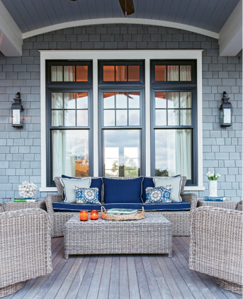 An inviting porch beckons at Kelly and David Lyle’s custom creekfront abode on Daniel Island. Check out the newlyweds’ laid-back yet luxurious style in The Charleston Home.