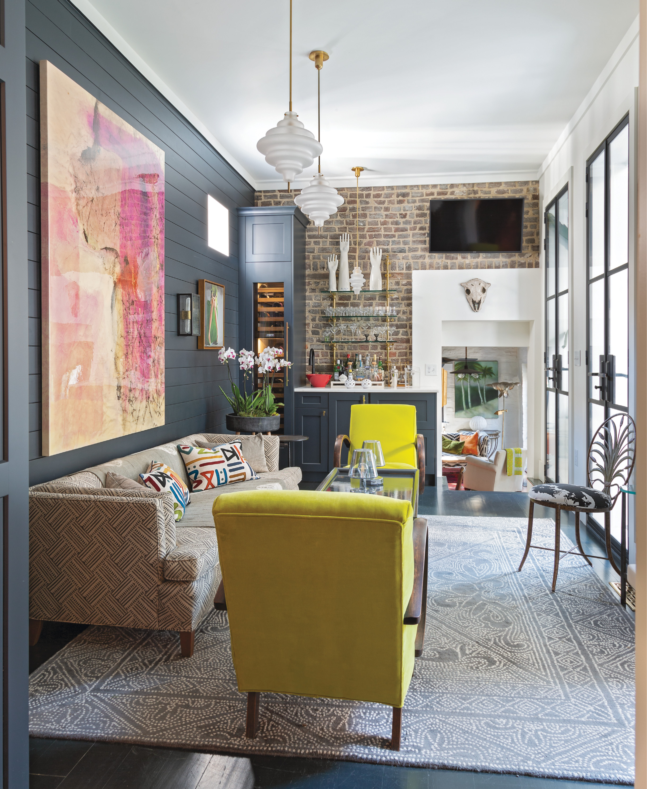 Trading Spaces: Formerly a slim galley kitchen, this “hyphen” connecting the Ansonborough single house to its guest suite was transformed into a chic lounge space, complete with wet bar.
