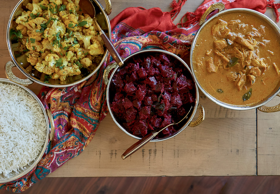 (From left to right) White rice forms a starchy base for spicy seasoned cauliflower, simmered beets, and hearty chicken curry.