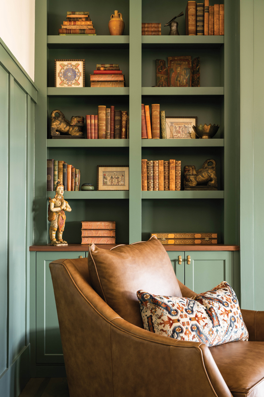 A window seat and comfy leather chair from Robin Bruce create additional cozy spaces in the room.