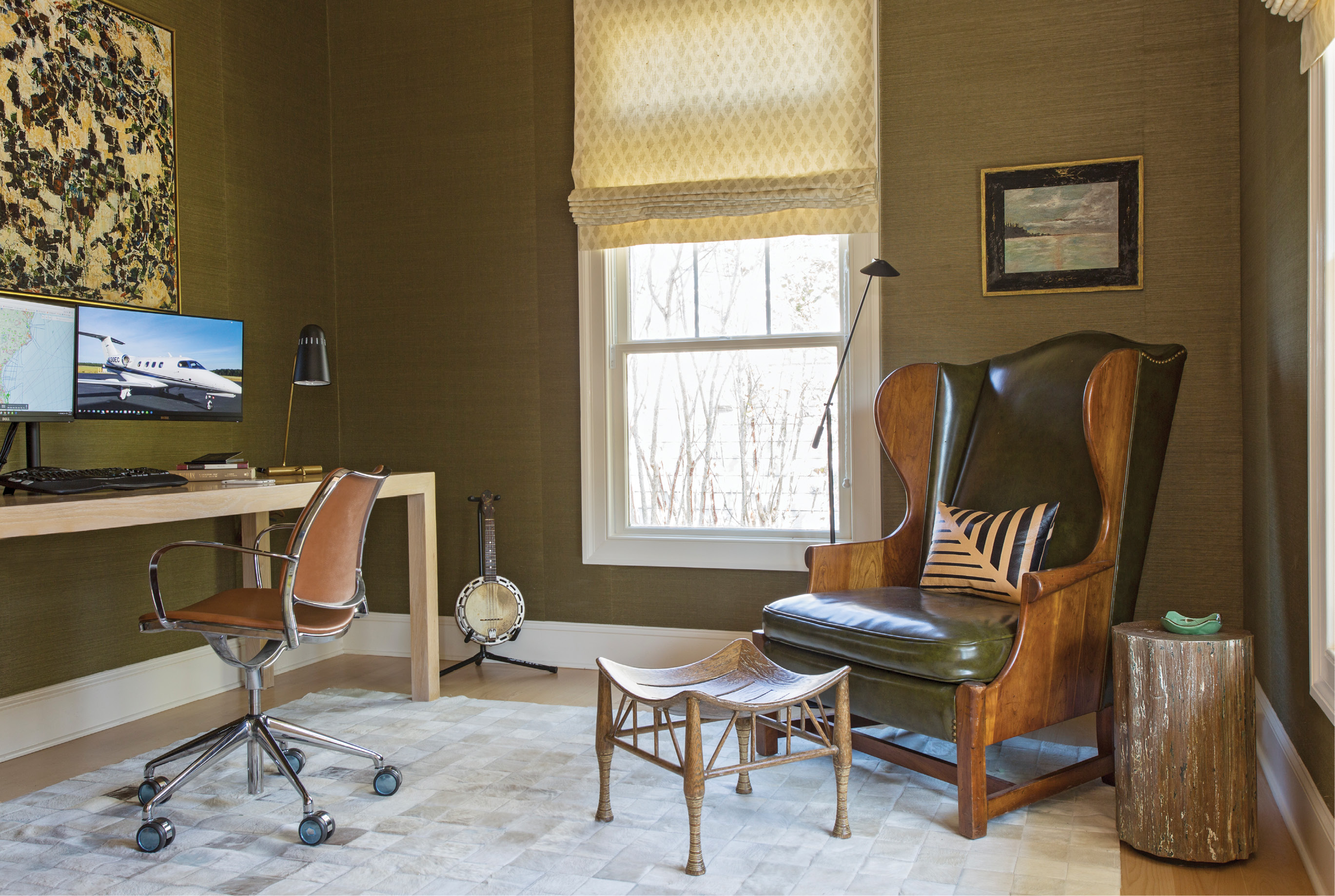 Phil’s home office features a custom desk crafted by Josh Brooks of J. Brooks Inc. and a vintage leather wing chair discovered at 17 South Antiques.