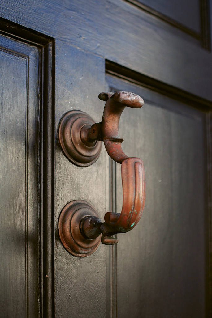 A physician’s knocker, a style once used to identify the home of a doctor, graces the front door.