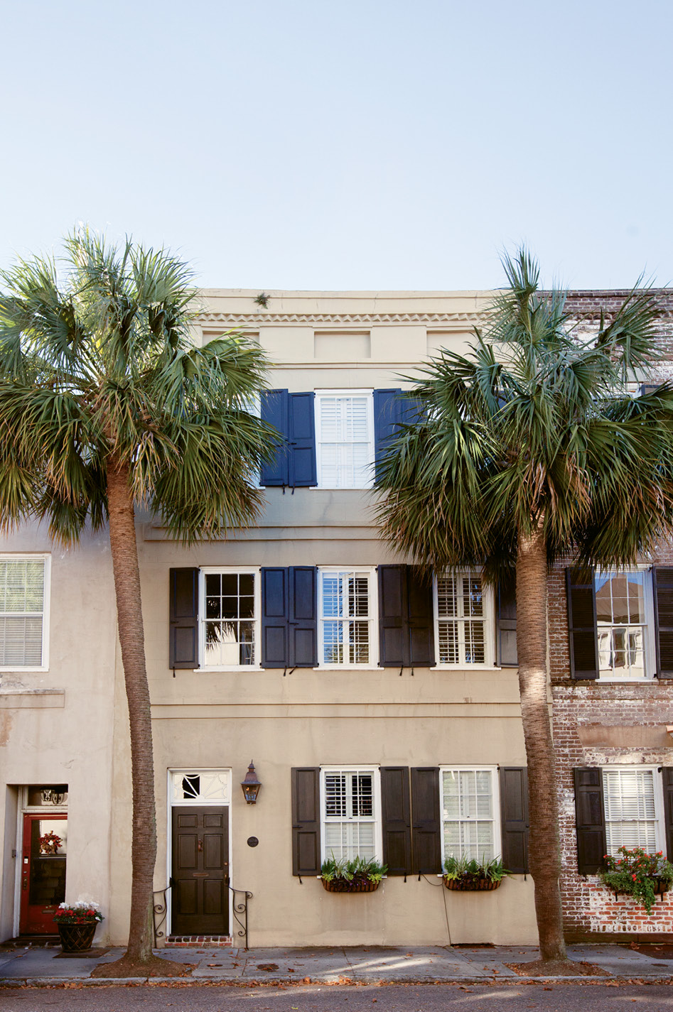 Come On In: Flanked by palmettos, the stucco-over-brick abode is the picture of Charleston charm.