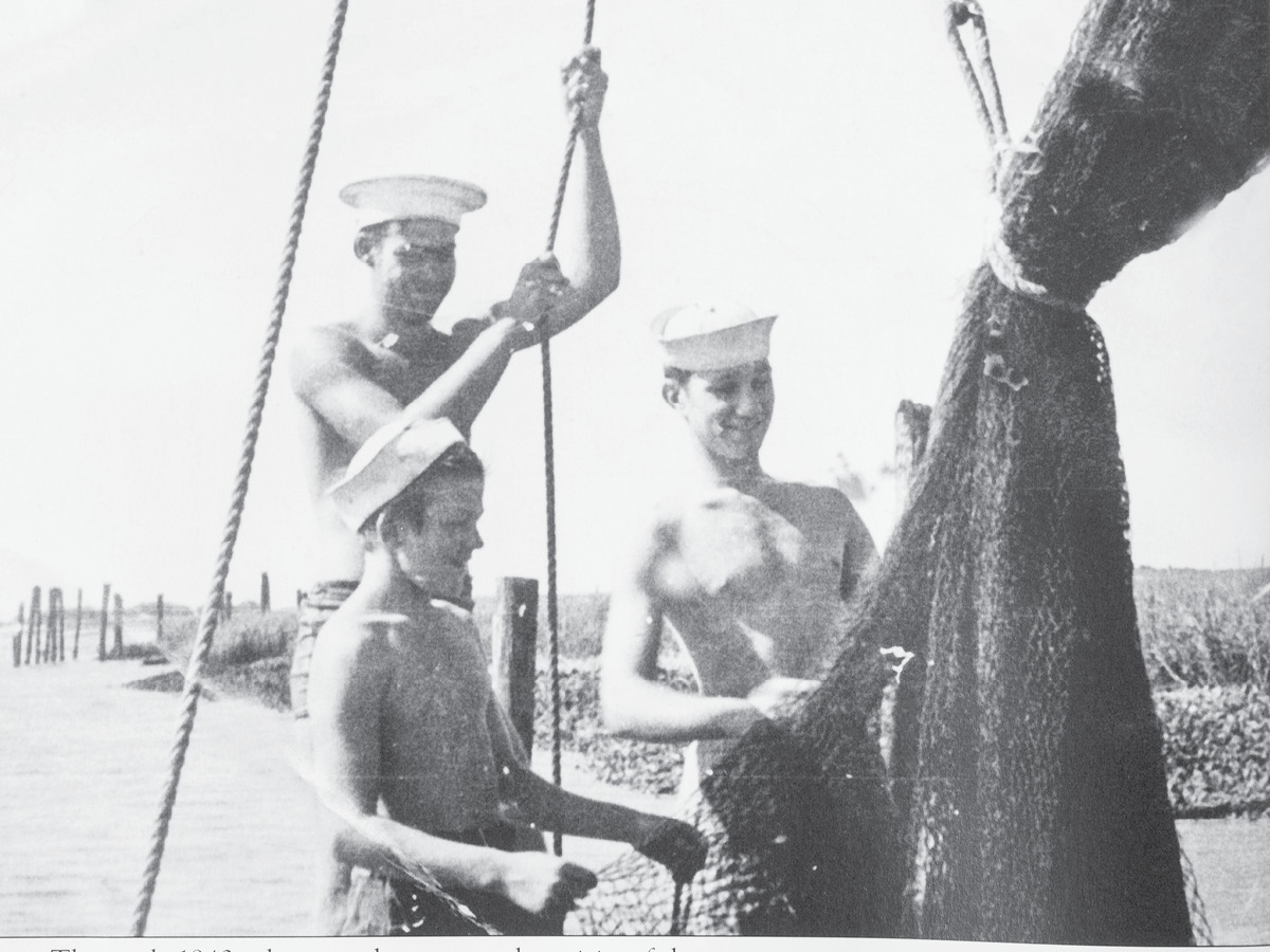 Magwood boys sewing shrimp nets circa 1940