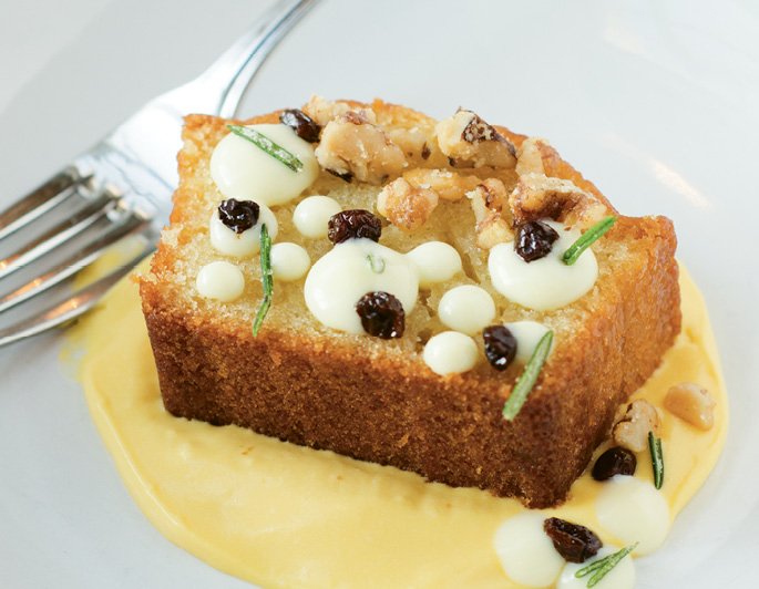 Light &amp; Bright: Toscano’s olive oil cake blends the best of savory, salty, and sweet with garnishes of pickled currants, candied rosemary, and olive-oil pudding.