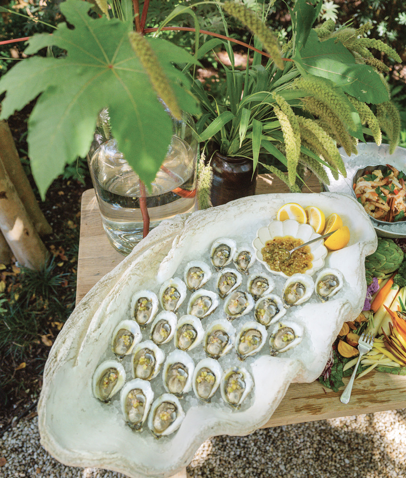 A giant decorative clamshell brimming with ice is the perfect vessel for local oysters. “The big scale makes it fun for a party,” he notes. “It’s great for Champagne bottles, too.”