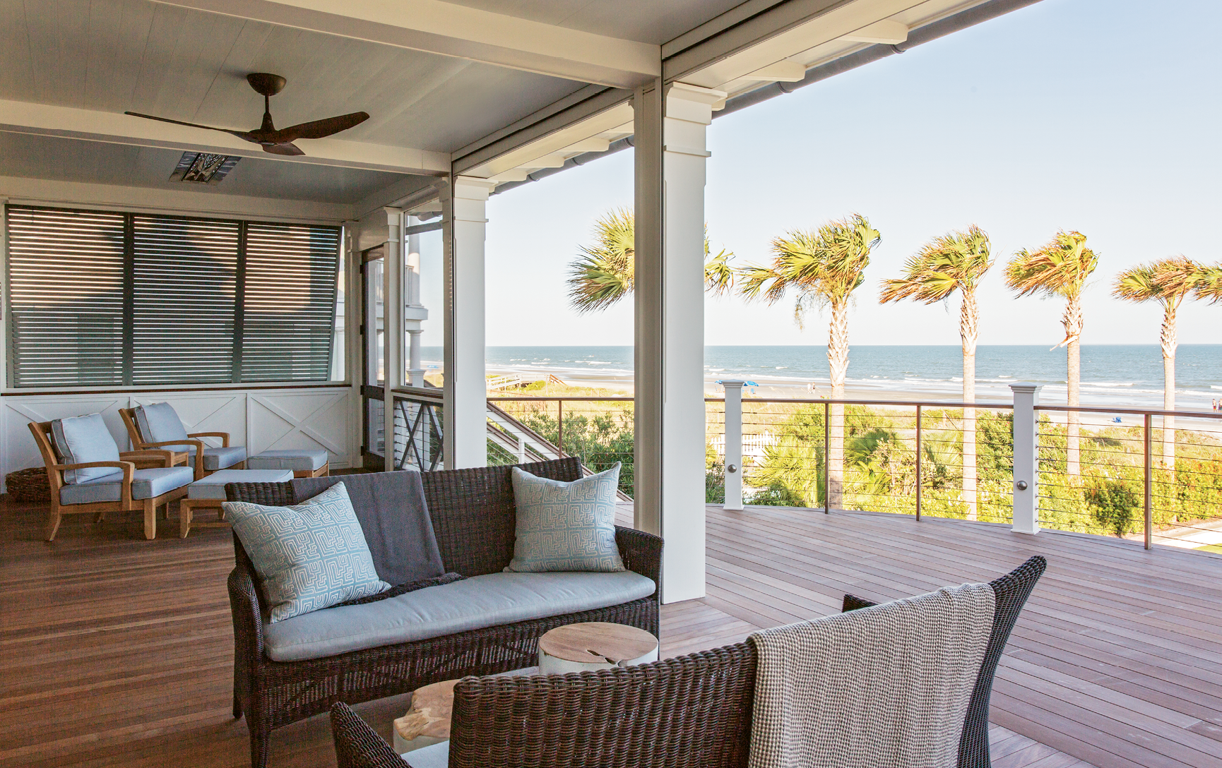 Kingsley Bate furnishings make this second-floor oceanfront patio feel like an extension of the family room.
